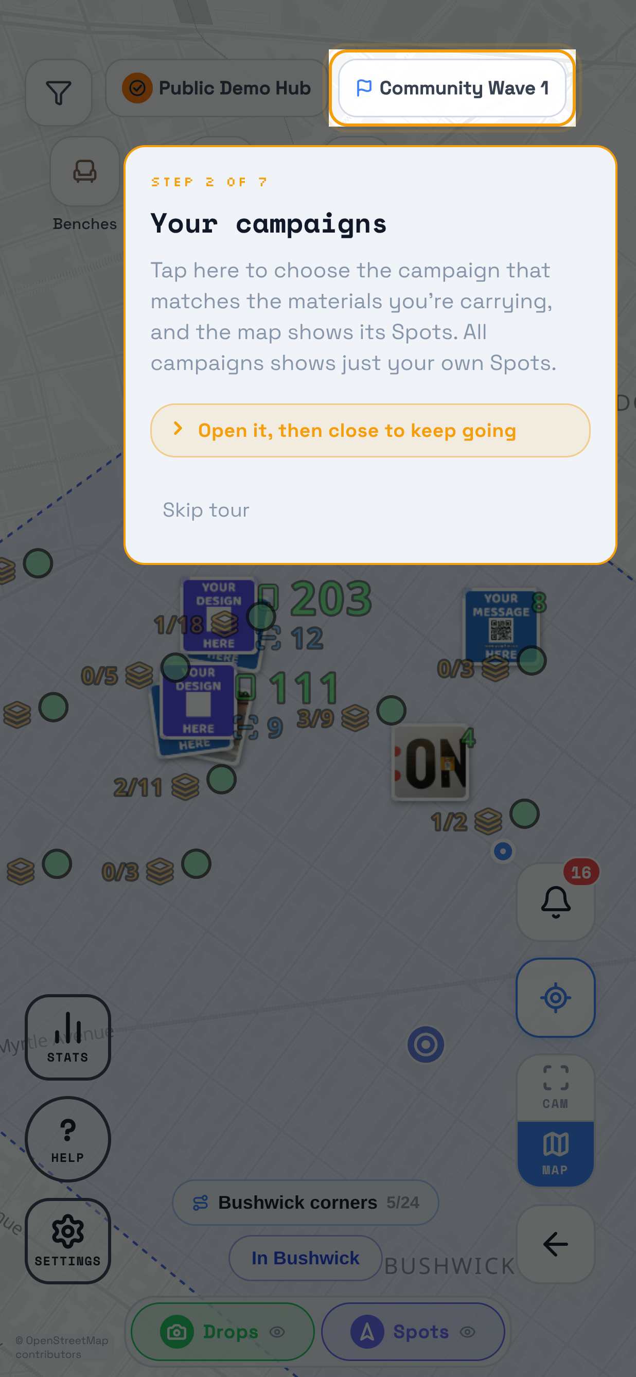 A walkthrough playing over the map in TraceReach Drop, the whole screen dimmed. Marked on it: the campaign pill reading Community Wave 1, which carries the walkthrough's own ring. The card under it reads Step 2 of 7, Your campaigns, then Tap here to choose the campaign that matches the materials you're carrying, then Open it then close to keep going, and Skip tour.