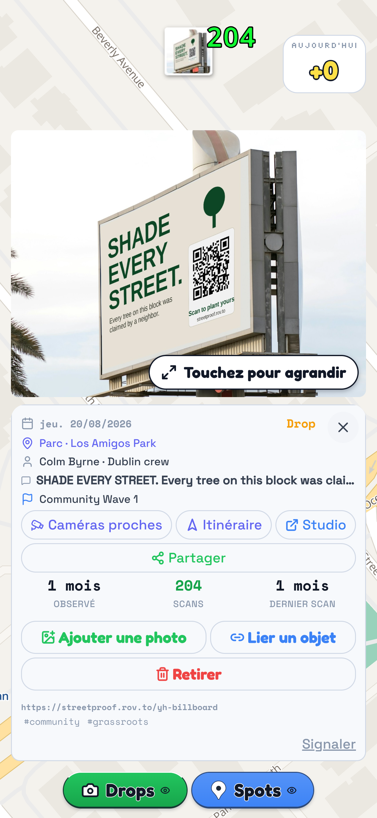 La carte de TraceReach Drop avec une fiche de Drop ouverte. Le repère entoure la fiche : la photo d'un panneau portant SHADE EVERY STREET et un QR, puis la date du 20/08/2026, le lieu Los Amigos Park, le nom de Colm Byrne de l'équipe de Dublin, le texte du support et la campagne Community Wave 1.